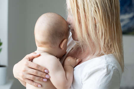 Portrait of a mother with her 6 months old baby, top view pointの写真素材