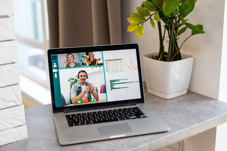 Work from home, video conferencing with coworkers due to  pandemic lockdown.の写真素材