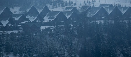 family with snowboards at winter resort