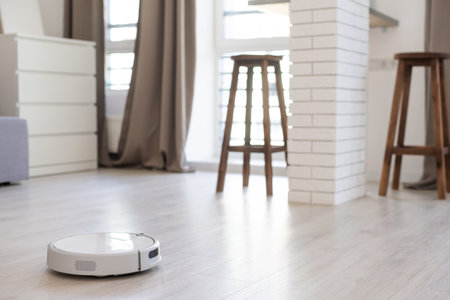 robotic vacuum cleaner on the floorの写真素材
