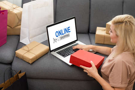 Young woman using laptop computer. Online shopping conceptの写真素材