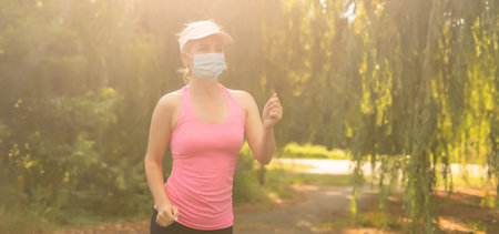 woman s goes in for sports on a street sports ground during a pandemic. virus in Europe.