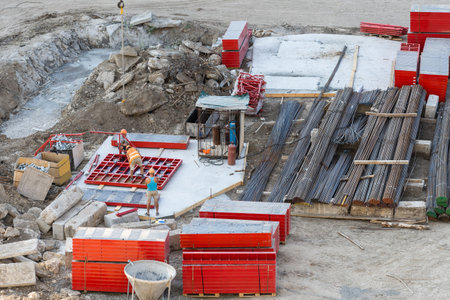 Closeup of house foundation made from concrete shuttering blocks filled with mortar and...