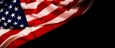 Close up of waving national usa american flag on black background with copy space for text. Concept of 4th of July or Memorial Day.の写真素材
