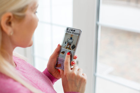 Smart phone online shopping in woman hand. Network connection on mobile screen. Payments online