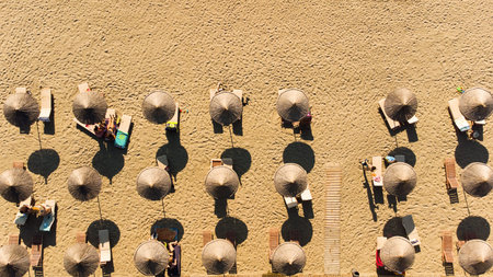 Sand beach aerial, top view of a beautiful sandy beach aerial shot with the waves rolling into the...