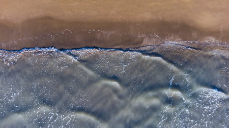 Soft wave of the sea on the sandy beach