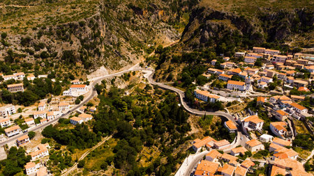a road go down between the albanian mountains