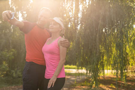It was really great workout, woman and man after workout in the forest.の写真素材