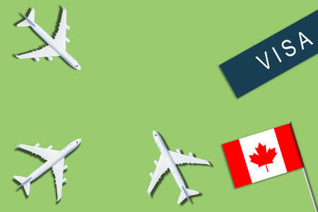 Passport near flag. Toy plane. Journey to country of opportunities. New document on old table.の写真素材