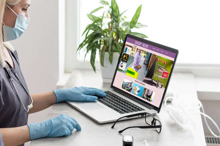 Doctor woman making online shopping.の写真素材