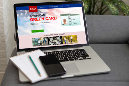laptop with Permanent resident card of USA website.の写真素材
