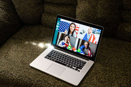usa flag and video by laptop, videoconferenceの写真素材