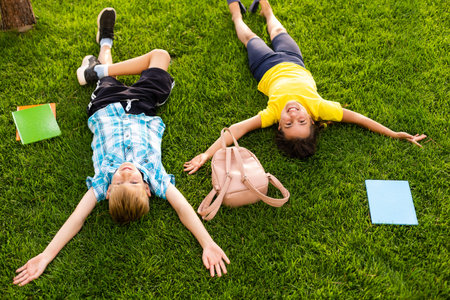 Portrait Of Excited Elementary School Pupils On Playing Field At Break Timeの写真素材
