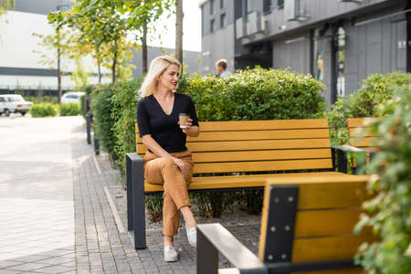 woman in a cafe drinking coffeeの写真素材