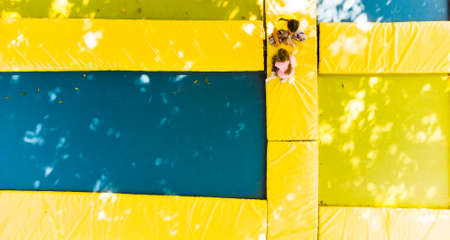 Childrens fun on garden trampolineの写真素材