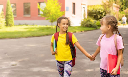 Happy Schoolgirls outdoor. Back to Schoolの写真素材