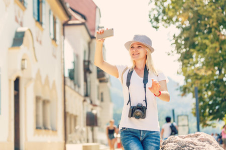 Young female tourist photographer. Having a great vacation in Germany
