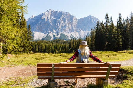 Hiker with backpack top of the mountainの写真素材
