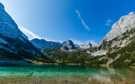 Stunning sunrise at lake in the Mountains in summer