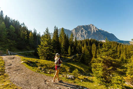 Young beautiful woman traveler , mountains Alps background,の写真素材