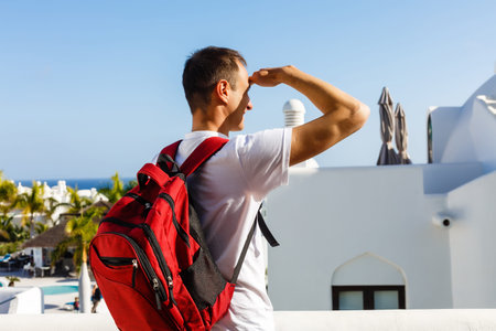 Hiker travel lifestyle young man with backpack, traveling alone