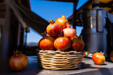 Pomegranates in basket at Market.の写真素材