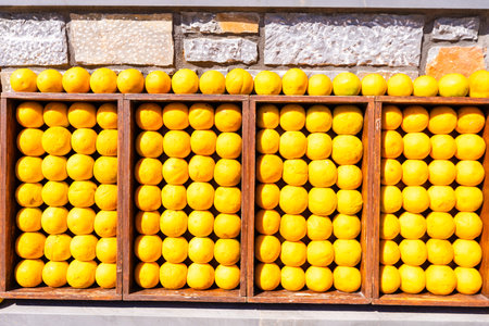 Orange fruit against wall. Mandarine oranges. Tangerine oranges. Orange color