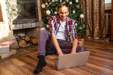 Man shopping for Christmas gifts onlineの写真素材