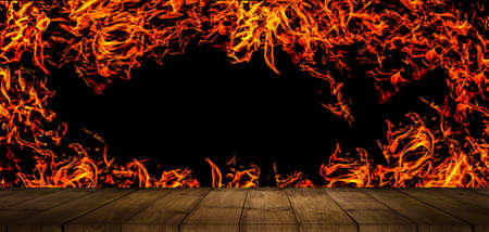 Wood table or stump on flame with bokeh background.の写真素材