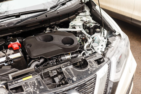 A car with an open hood in serviceの写真素材