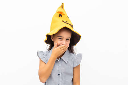 little girl in a witch hat. halloween.の写真素材