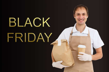 black friday and the delivery man. Delivery concept. Delivery service concept. Copy space. Black friday concept.の写真素材