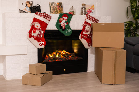 delivery christmas gifts. delivery boxes near fireplace before christmas
