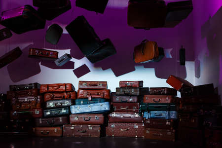 Pile of colorful vintage suitcases.の写真素材