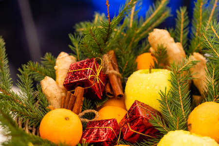 Christmas background with fir tree and tangerines.の写真素材