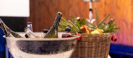 Wine bottles set in bucket, alcohol coolingの写真素材