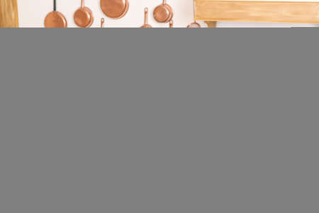 Smiling woman sitting surfing the internet on a laptop computer at home,の写真素材