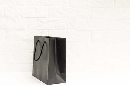 Black shopping bag on white.の写真素材