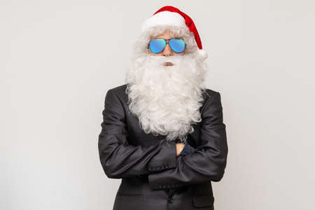 Modern Santa Claus in sunglasses, cool santa in suitの写真素材