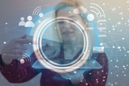 Woman hand using tablet with wifi icon. Business communication social network concept.の写真素材