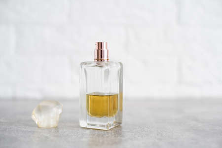 Perfume bottle on light wooden table.の写真素材