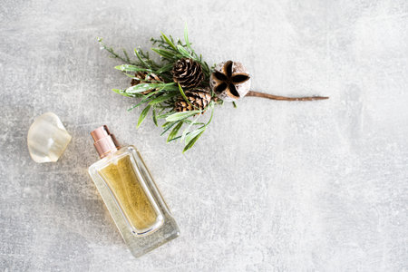 Perfume bottle on light wooden table.の写真素材