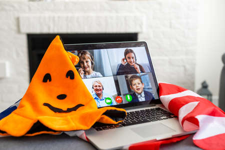 Halloween online holiday remote celebration halloween in lockdown coronavirus quarantine covid 19 new normal, social distance, remote communication, stay home vocationの写真素材
