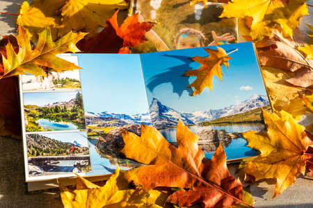 Photobook on the leaves background, closeup of photobook, family photo albumの写真素材