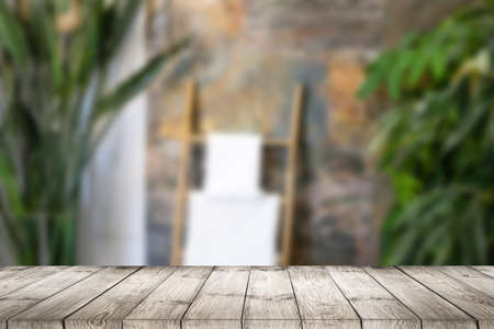 Wood table top on blurred green background - can be used for montage or display your productsの写真素材