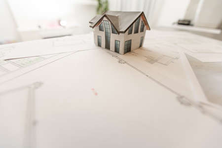 Design and construction of cottages. Layout and drawing of a country house. Architecture and construction. Layout of the house, boards. Private house.の写真素材