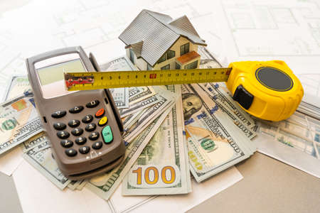 mortgage, investment, real estate and property concept. close up of home model, Thai money and house keysの写真素材