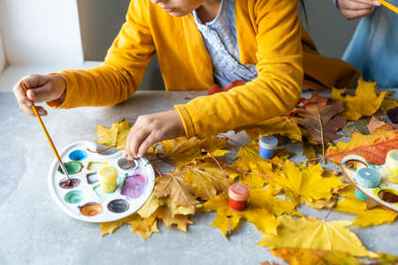Happy family doing autumn decor. Fall atmosphereの写真素材