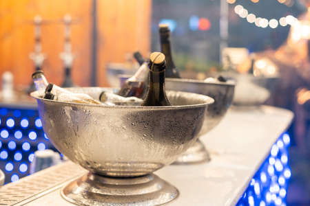 Wine bottles set in bucket, alcohol coolingの写真素材